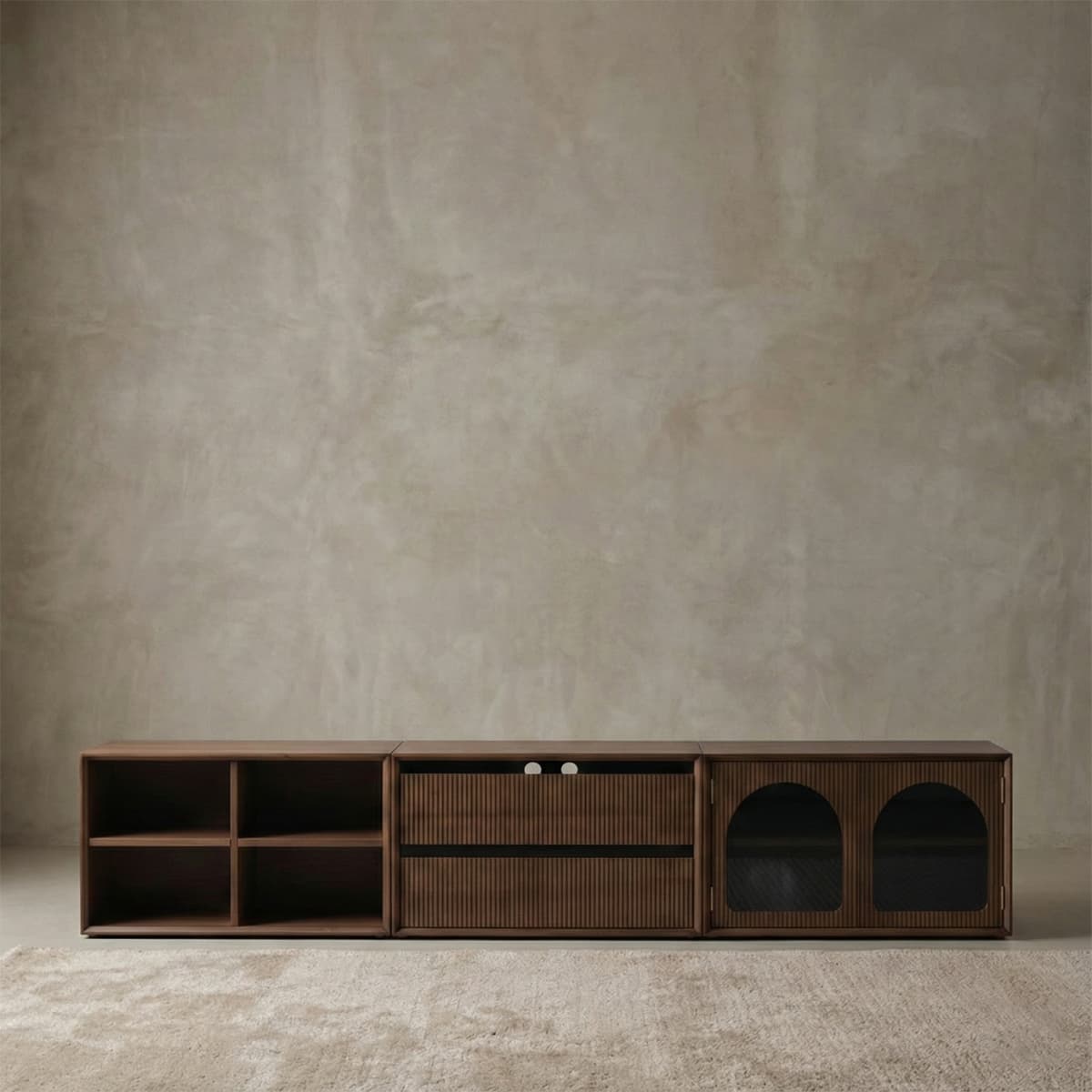 Multifunctional solid walnut media console featuring open shelving, fluted drawer fronts, and arched glass cabinet doors for a sophisticated living room centerpiece.