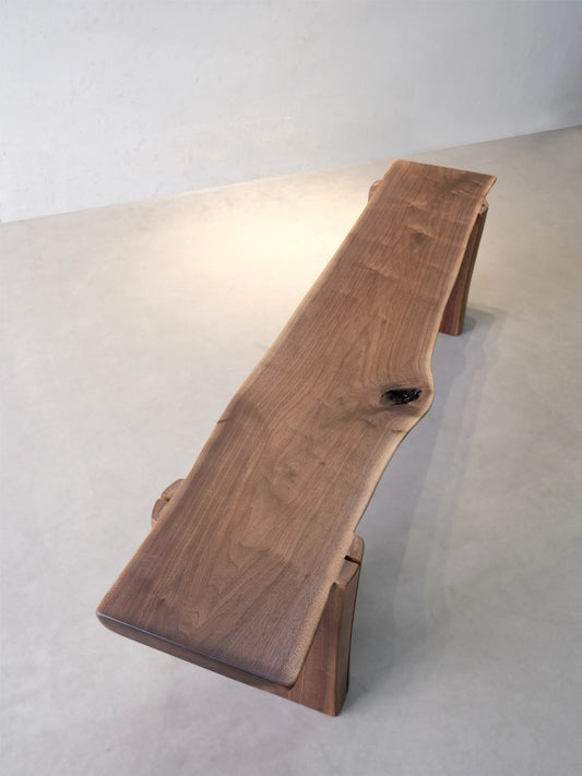 Walnutry Wilder organic wood bench top view showing the live edge contour, natural walnut grain movement, and handcrafted wood surface detail.